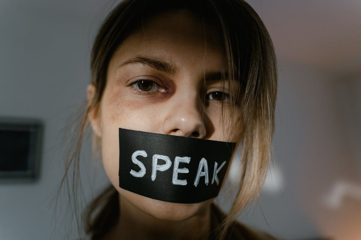 Woman With Black Tape on Her Lip